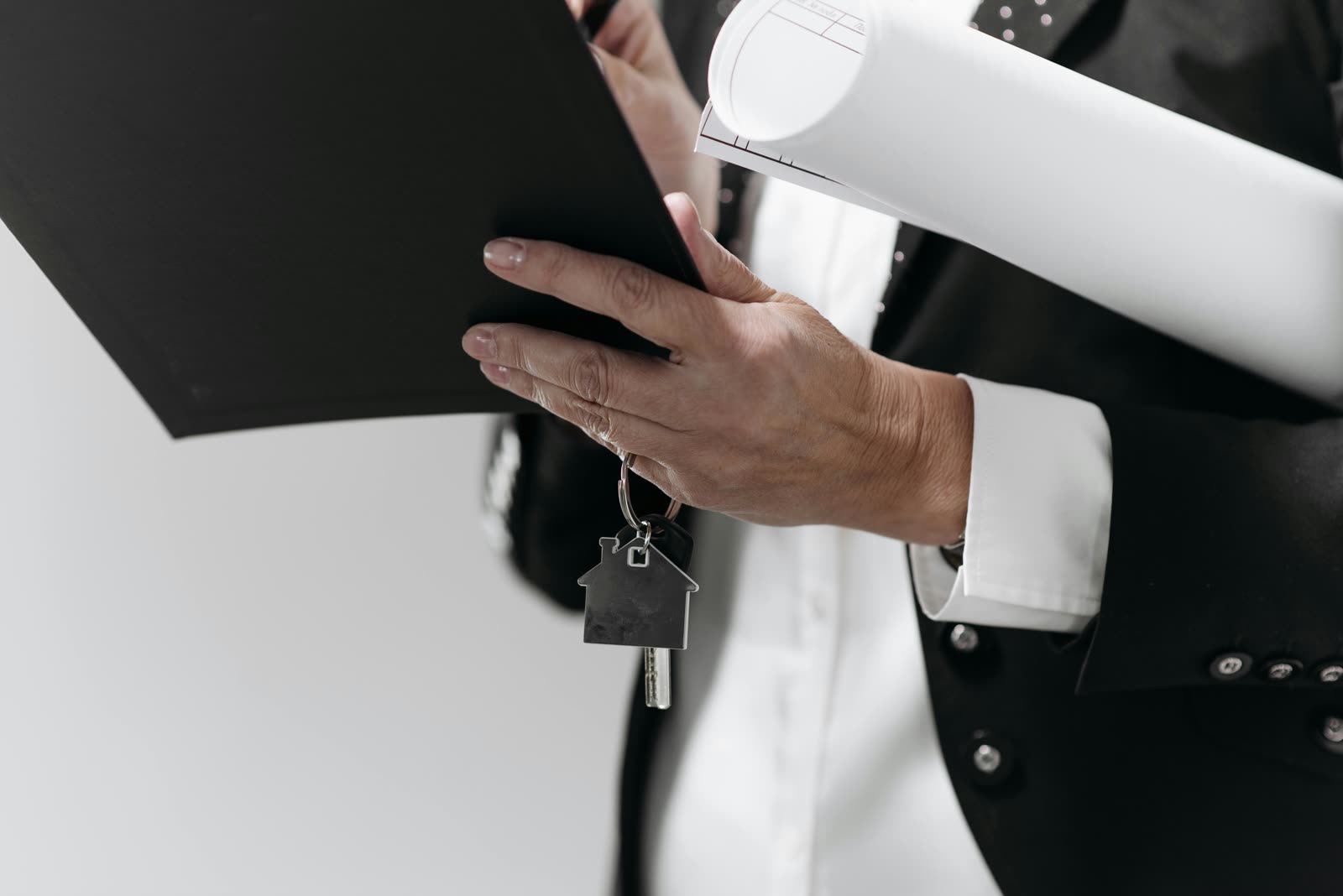 House keys resting on a contract clipboard