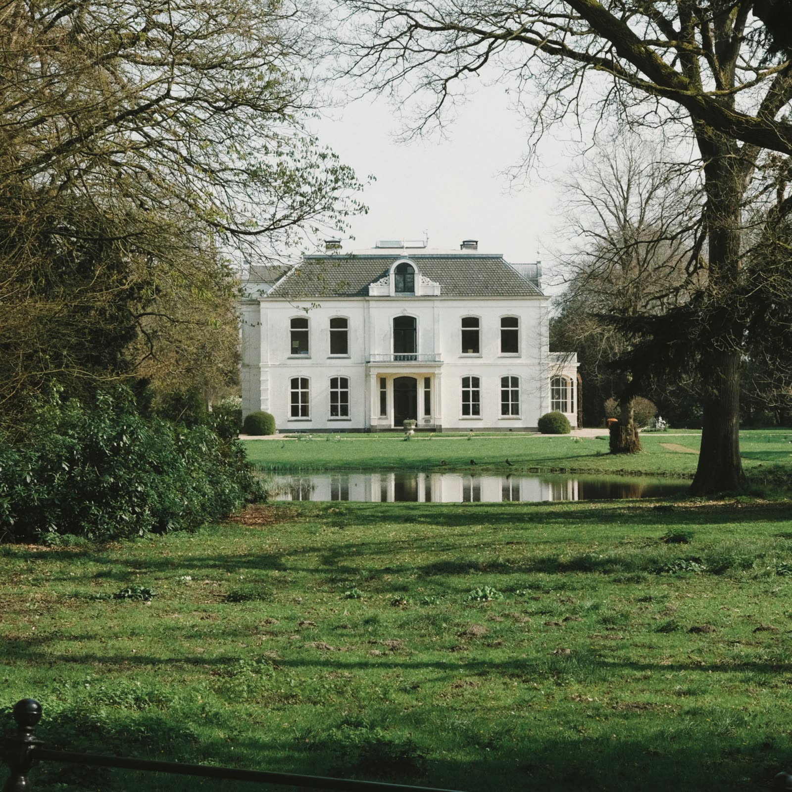 White UK home with a for-sale board outside